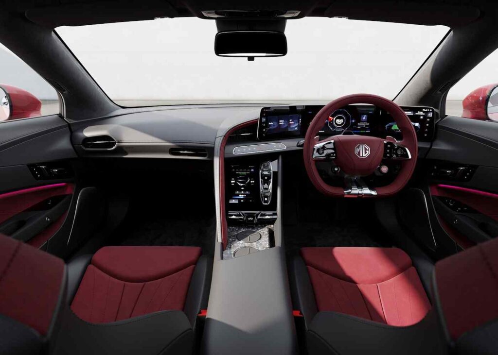 MG Cyberster 2025 interior with tri-screen dashboard, red-black bucket seats, and futuristic steering wheel