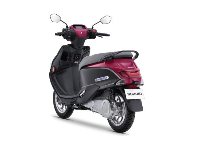 Rear view of Suzuki e-Access 2025 electric scooter with dual-tone black and pink design