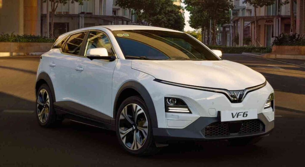 VinFast VF 6 electric SUV parked on a city road with sleek LED lights, modern aerodynamic body and bold front styling